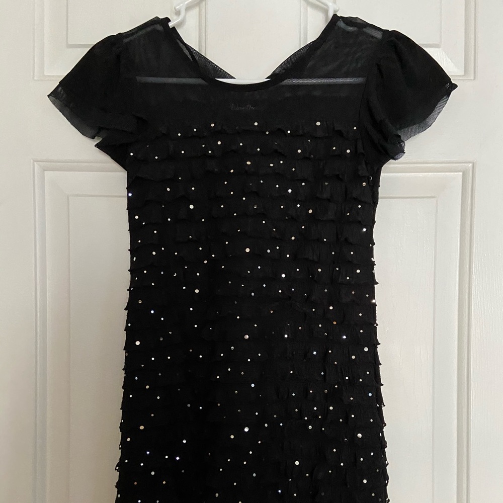 Girl’s sparkly black dress.